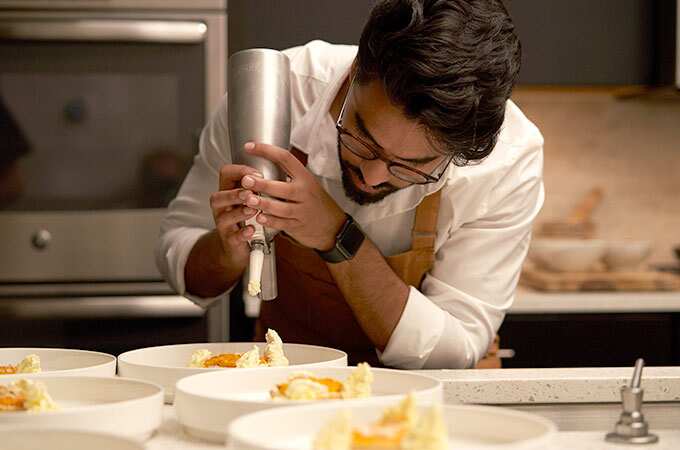 Chef Aakash Trivedi prepares another course.